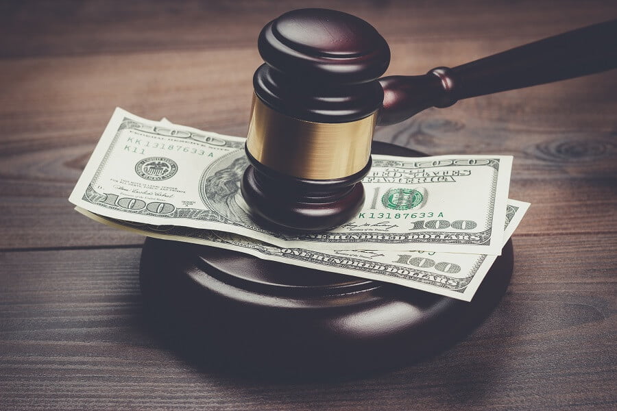 judge gavel and money on a wooden table