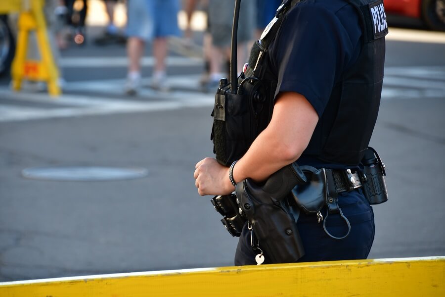 police officer standing guard on the road