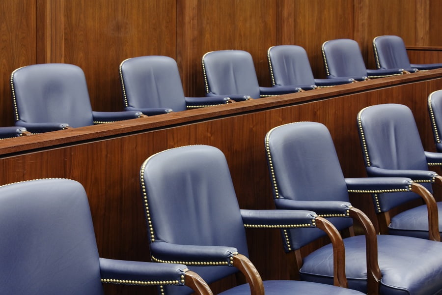 Empty jury seats in a courtroom