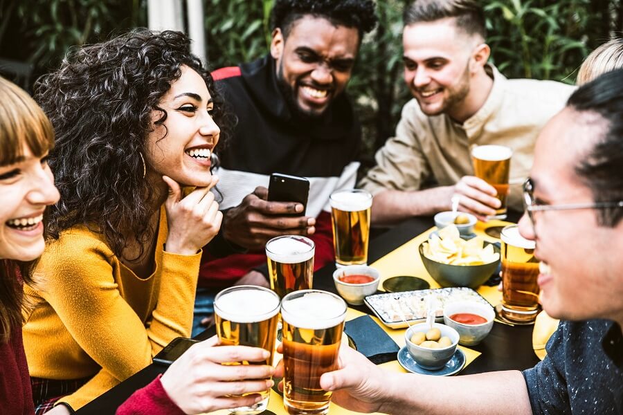 Friends drinking beer at a pub