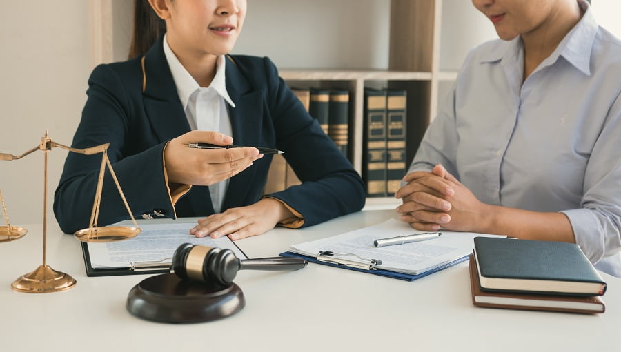 Woman judge is advising her client on an involved case