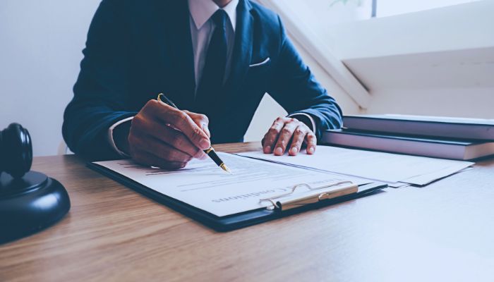 Lawyer writing something on the paper 